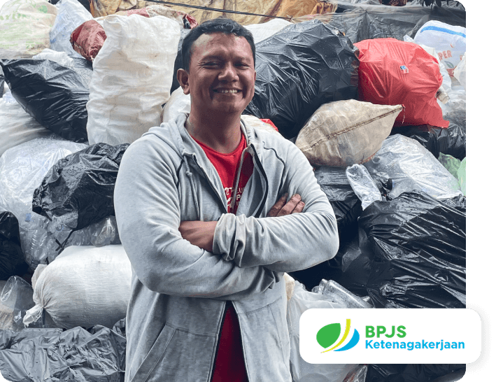 A waste worker covered by BPJS Ketenagakerjaan social protection